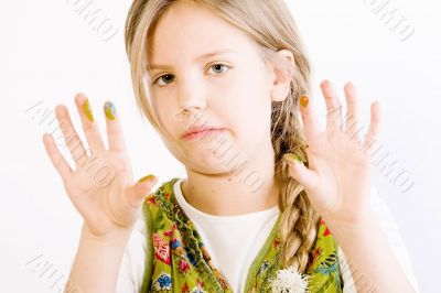 Young girl with paint on hands Young girl with paint on hands