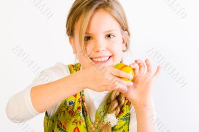 Young girl presenting her painted egg