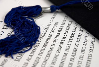 Graduation hat and diploma