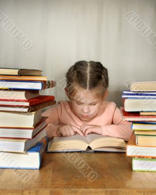 The little girl attentively read