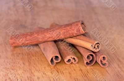 Cinnamon sticks on a wooden board