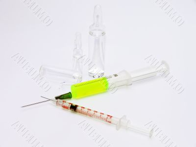 Two syringes and broken ampules
