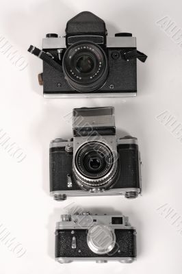 Three photo cameras