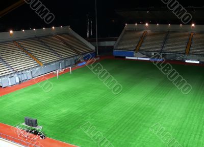 Empty soccer stadium in the night