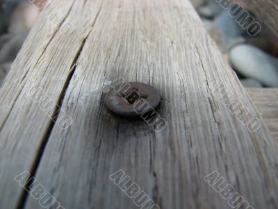 Nail in board