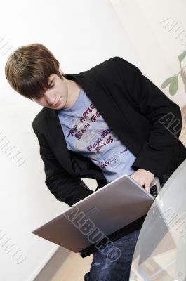 confident young manager at work with laptop