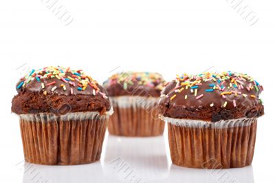 Three muffins with chocolate