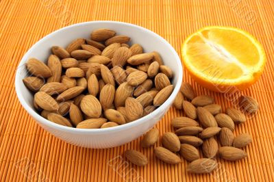 Fresh almonds and orange Fresh almonds and orange