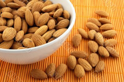 Bowl of almonds on rattan mat