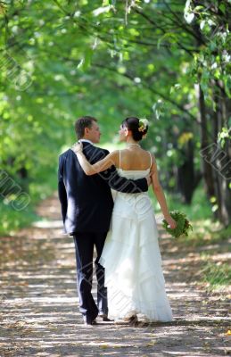 Bride and Groom Walking into Distance