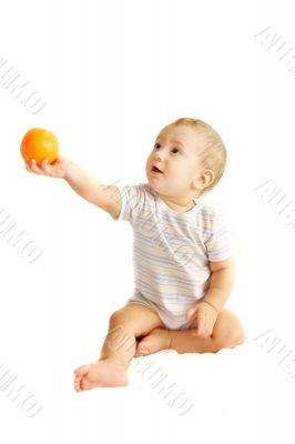 baby boy giving an orange over white