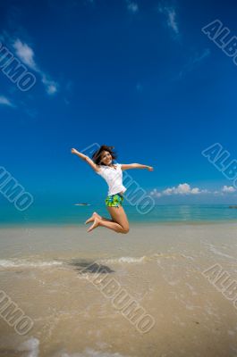 happy jump at the beach