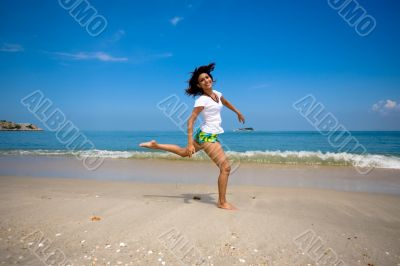 jumping joyfully at the beach jumping joyfully at the beach