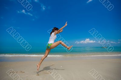 happy jump at the beach