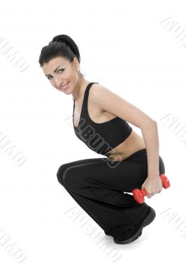 beautiful girl with dumbbells