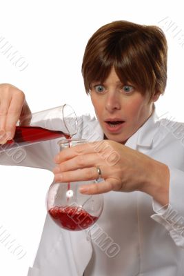 worried lady scientist pouring liquid