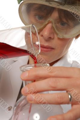 confident lady technician pouring liquid
