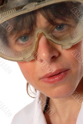 young lady technician in safety goggles