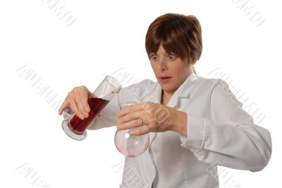 worried lady scientist pouring liquid