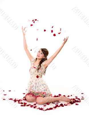 young girl tossing rose petal