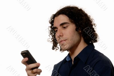 Young man texting on mobile phone
