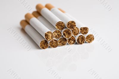 Cigarettes on reflective surface