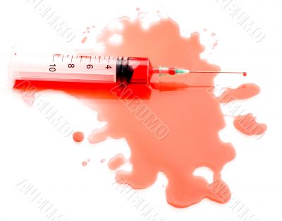 Syringe in a pool of blood