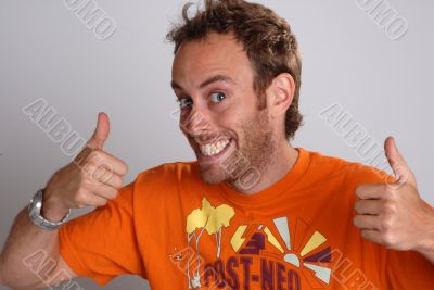 young man giving thumbs up sign