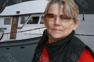 older active senior at boat dock