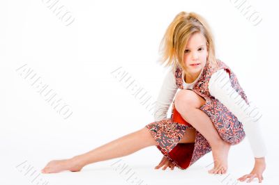 Blond child stretching her leg