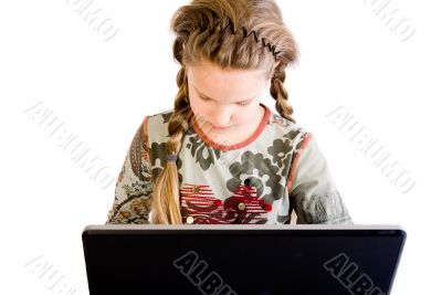Blond child concentrated with notebook