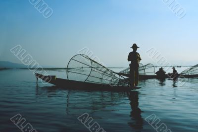 fishermen on water