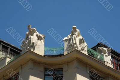 Prague rooftop statues on historic building