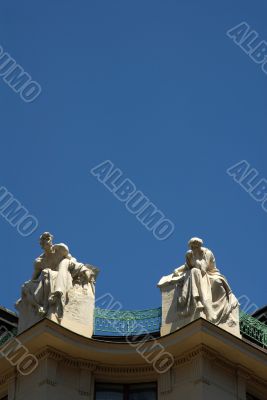 Prague rooftop statues on historic building