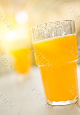 Orange juice in summer light