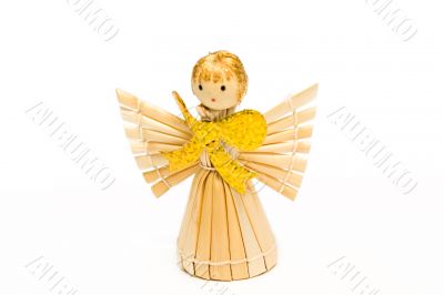 The angel made of straw, with the big gold bow