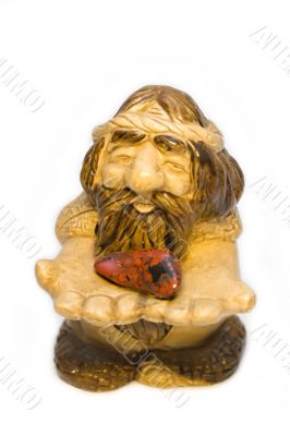 Figurine of the old man with stone heart in hands