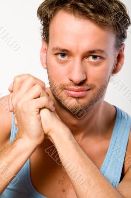 Portrait of a young adult man in a blue shirt