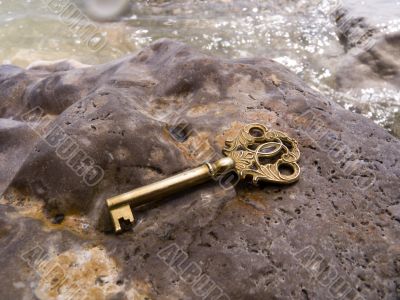 Key on a wet stone Key on a wet stone