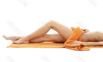 long legs of relaxed lady with orange towel 4 long legs of relaxed lady with orange towel 4