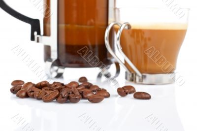 Cup and coffee pot and beans