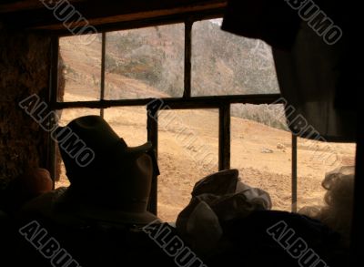 window in a poor house in the andes of peru