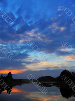 sunset sky in blue and rose clouds