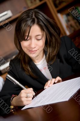 business woman signing a contract