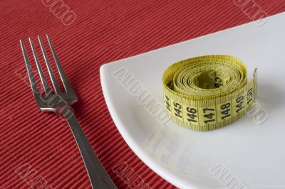 Fork, plate and a measure tape