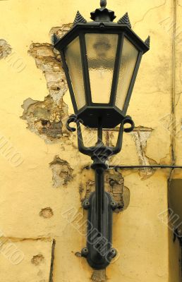 Old metallic lantern on the wall