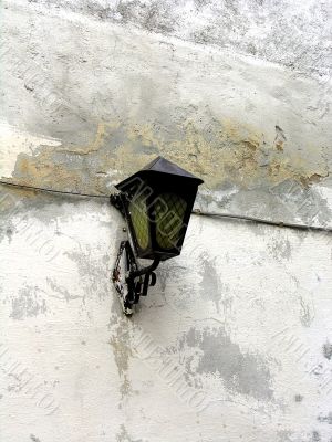 Old metallic lantern on the grunge wall