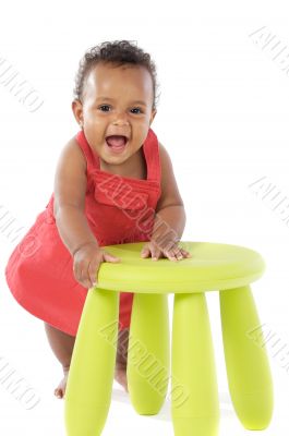 Toddler playing with a chair