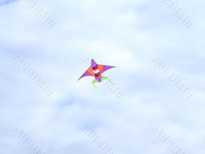 Flying kite in a blue sky