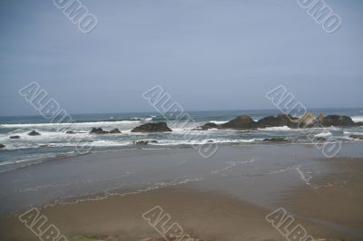 Waves breaking on volcanic rocks